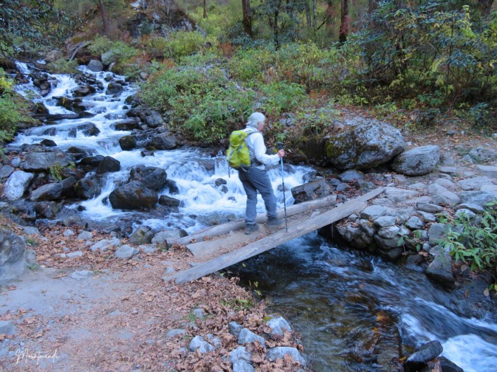 Crossing stream during Langtang Trek
