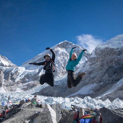 Trekkers Jumping at Everest Base Camp for Photo