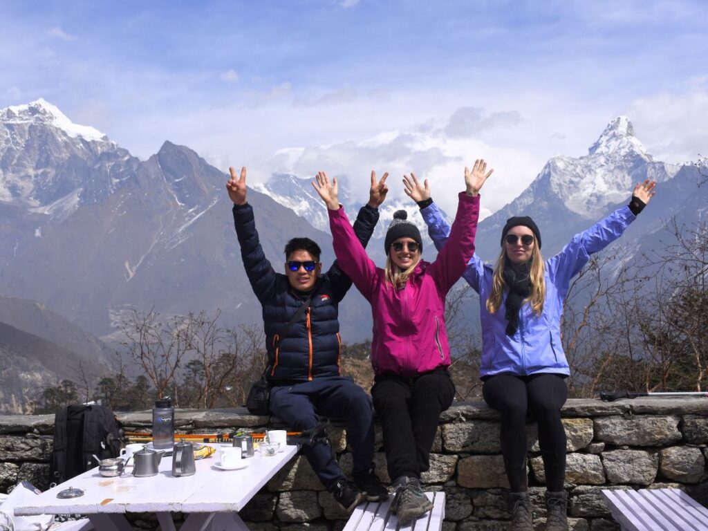 Trekkers posing with Mount Everest at Hotel Everest View