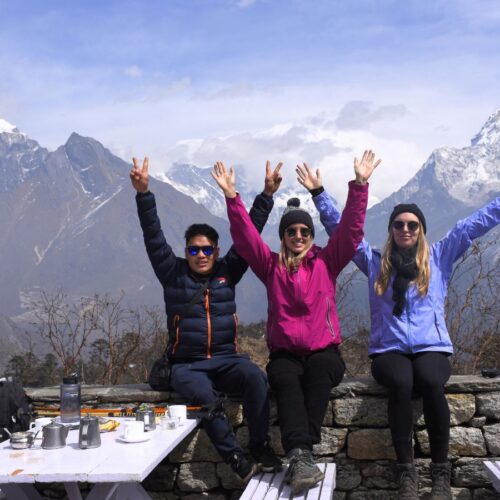 Trekkers posing with Mount Everest at Hotel Everest View