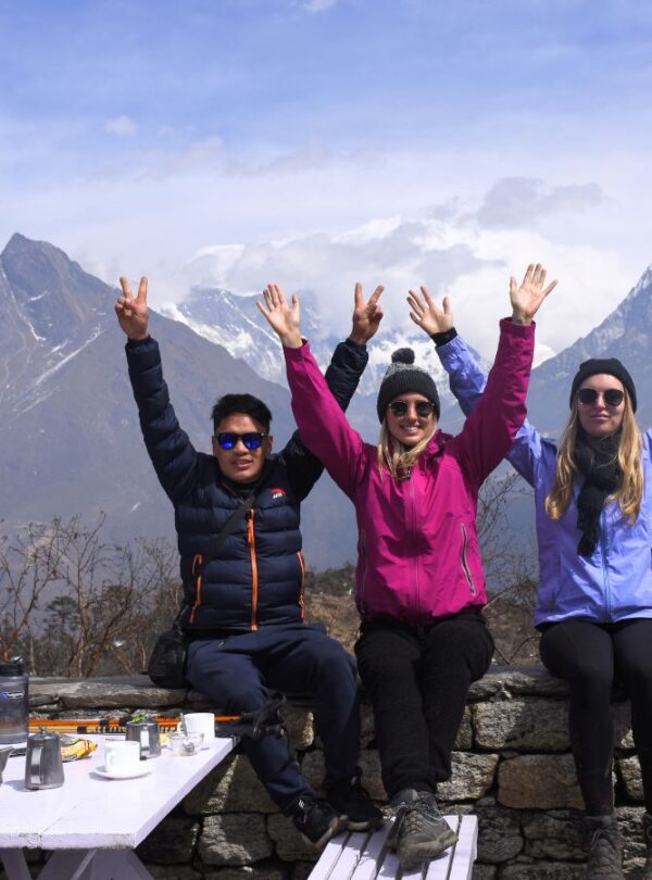 Trekkers posing with Mount Everest at Hotel Everest View