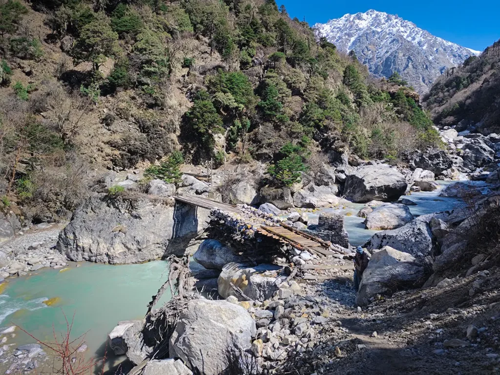Crossing a stream during Langtang trek