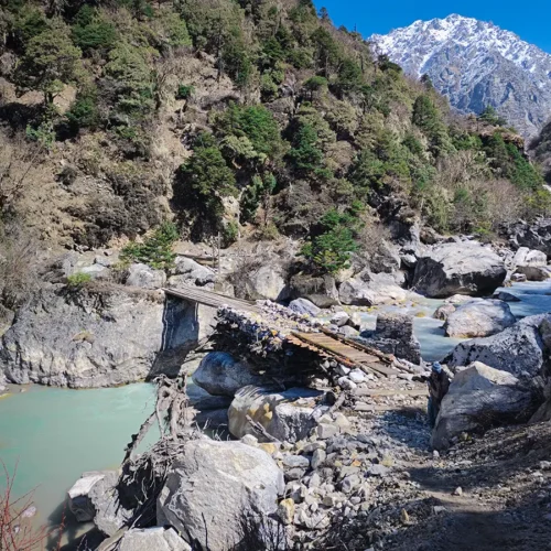 Crossing a stream during Langtang trek
